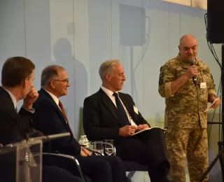 Nicholas Burns, Mike Scaparrotti, and Tim Radford welcome Borys Kremenetskyi